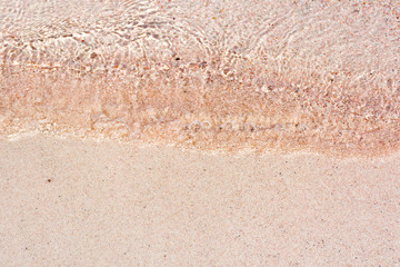 texture-pink sand on the beach