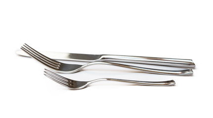 Glossy cutlery, fork, knife isolated on white background