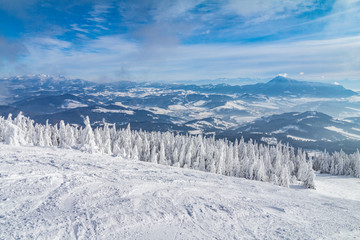 Beautiful scenery of the snowy winter landscape. View from Kubinska hola mountain in Slovakia, Europe.