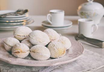 Walnut shaped cookies with cream. Shortbread with caramel and walnuts stuffing. Russian or ukrainian sweets oreshki.  Copy Space.