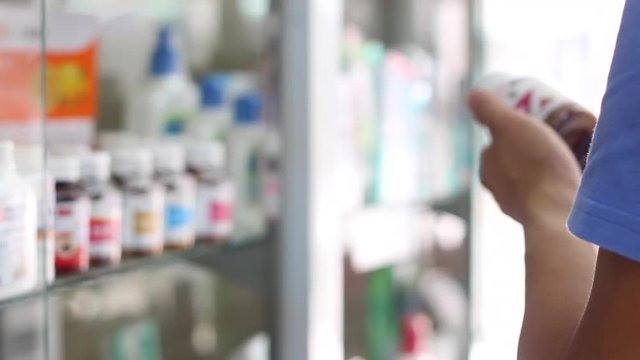 Buyer Customer Read Drug Label Bottle Contain Medicine Pill In Drug Store