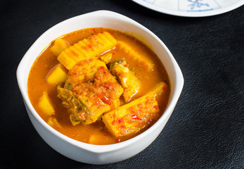 Thai Sour Curry orange with fish and mixed veggies,Southern Thai Spicy Sour Yellow Curry with Sea Bass and Coconut Shoots