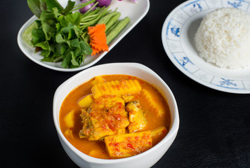 Thai Sour Curry orange with fish and mixed veggies,Southern Thai Spicy Sour Yellow Curry with Sea Bass and Coconut Shoots