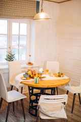 small family feast. table with delicious dishes in the room with modern interior.empty room with yummy food on the table