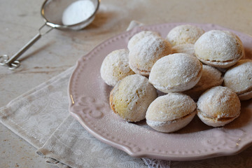 Walnut shaped cookies with cream. Shortbread with caramel and walnuts stuffing. Russian or ukrainian sweets oreshki.  Copy Space.