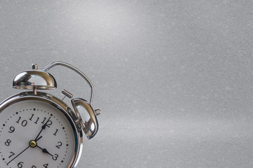 Retro alarm clock on a gray and white background with copy space for text