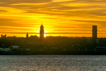 View from Albert Dock Liverpool Merseyside skyline at sunset