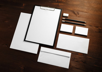 Blank stationery set on wood table background. ID template. Mockup for branding identity for...
