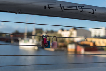 Locks on a bridge. Love signs.