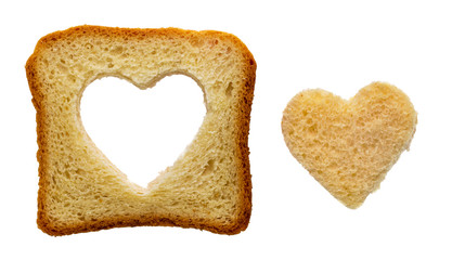 Toast bread slice with a heart shape carved, isolated on white