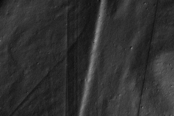 Abstract background crumpled plastic film texture black garbage bag
