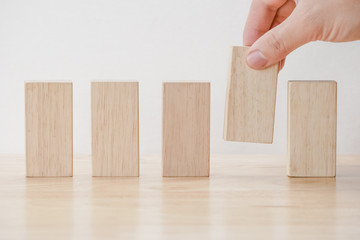 business finance. growing Profit concept,Hand arranging wood block