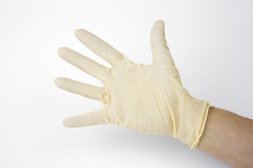 medical protective latex gloves on male hand on white background