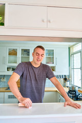 Handsome guy posing - frustrated man cleaning the table