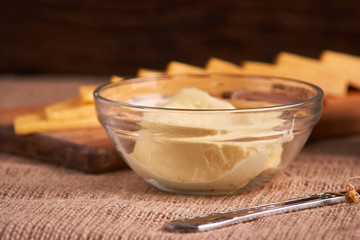 Butter and chees and milk for breakfast, over rustic wooden background with copy space. Morning breakfast