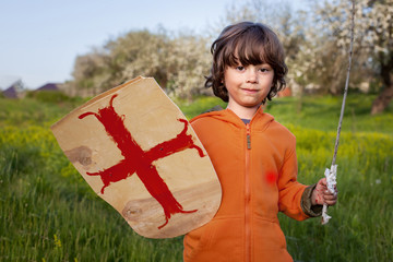 boy playing in medieval knight