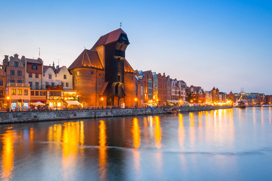 Fototapeta Old town of Gdansk reflected in Motlawa river at dusk, Poland