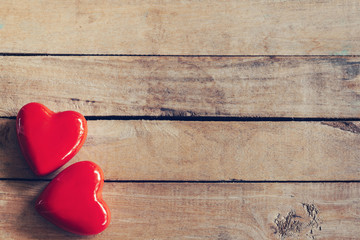 two red heart on wood table background with copy space