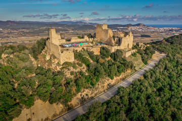 Fototapeta na wymiar Aerial view of Palafolls castle medieval ruined stronghold between Girona and Barcelona on the Costa Brava an example how graffiti can ruin a cultural heritage site