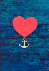 valentine's day,wedding,anniversary card/red heart  and anchor on blue rusty wooden background