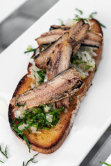 Portuguese tiborna open toast sandwich tapas with sardine and onion garlic