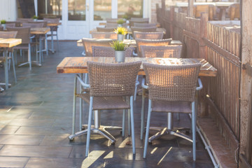 Cafe, coffee shop, tavern and restaurant concept - Empty tables in between dining hours in Europe town.