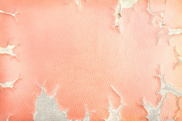 Colorful texture of old red leather with ripped patterns torn texture for background, hole and...