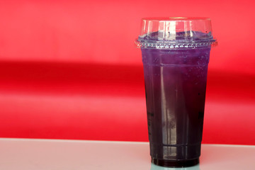 Butterfly pea and lemon juice on blue background and space for write wording