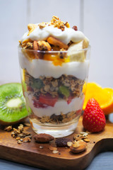 Yogurt parfait with granola and fresh fruit, healthy breakfast concept