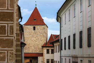 Obraz premium old tower and houses in city