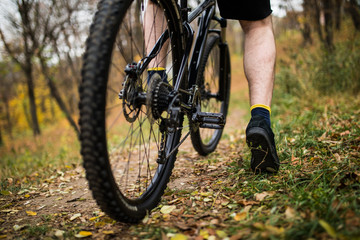 Fototapeta premium Cycling outdoors, close up of the feet near pedal. Close up