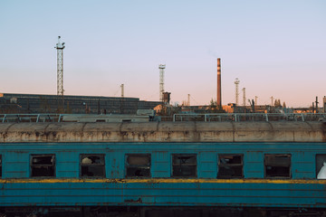 Fototapeta na wymiar old wagons at the plant for repairing railway equipment.