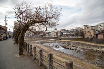 Fototapeta na wymiar Sightseeing on Kajibashi bridge near Miyagawa Morning Market in Takayama Japan. Takayama is famous for its well-preserved Edo style street and houses.