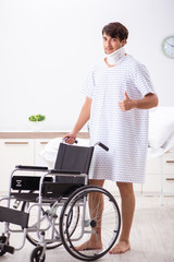 Young handsome man in wheelchair at the hospital 