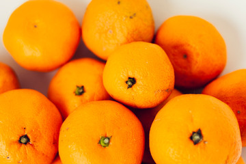 Fresh whole mandarin oranges background , top view.