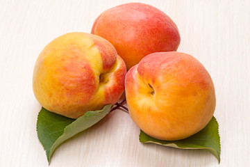 Three apricots on the table