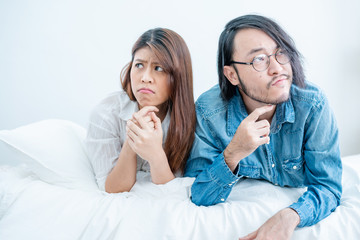 husband and wife family problem lover disagree in decision and look different way bedroom background