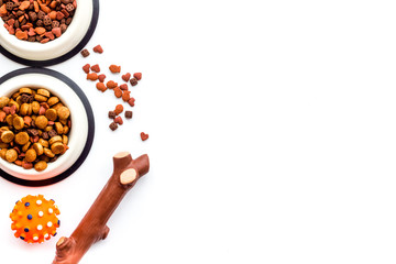 Animal food in bowl on white background top view copy space