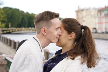 charming good couple husband and wife walking around the city, hugging and spending time with love