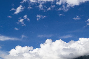 Naklejka na ściany i meble Blue sky with white clouds. Bright blue sky with white clouds.