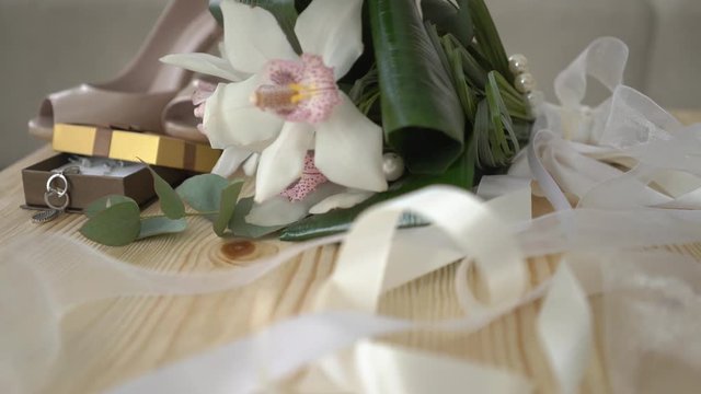 4K Dolly Shot Of Bride Shoes And Bouqet On Wedding Day