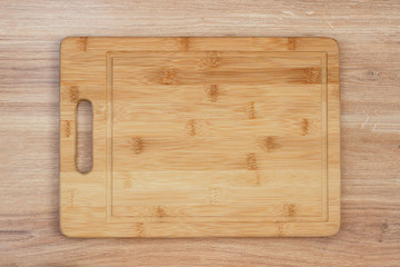 Blackboard on a wooden table. Top view mockup