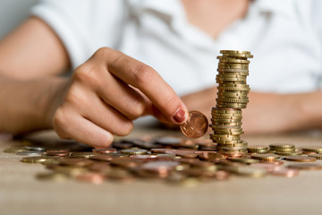 Pictures of hands and money of businessmen on the desk. Saving ideas with copy space.