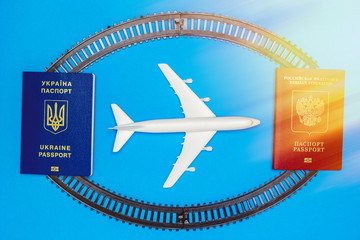 Ukrainian and Russian passports, rails and model aircraft. The concept of passenger traffic between Ukraine and Russia