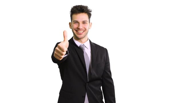 Young businessman giving thumbs up isolated on white