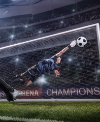 goalkeeper jumping for the ball on football match