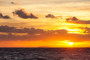 Sunrise or sunset over sea surface