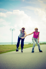 roller skater couple skating outdoor
