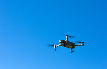The drone copter flying with digital camera.
