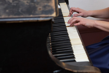 Fototapeta na wymiar closeup musician hands playing piano on piano keyboard.